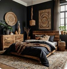 a bedroom with black walls and wooden furniture