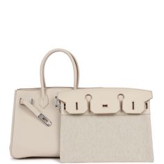 This limited edition 3 en 1 Birkin is in Beton togo and swift leather with palladium hardware and has tonal stitching, a removable front flap in canvas and swift leather, two straps with center toggle closure, clochette with lock and two keys, and double rolled handles.The interior is lined with Beton chevre and has one zip pocket with an Hermes engraved zipper pull and an open pocket on the opposite side.Collection: UOrigin: FranceCondition: New and never worn (plastic on hardware) Accompanied Birkin 30, Color Making, Lv Bags, Hermes Box, Handbag Patterns, Gorgeous Bags, Hermes Bag, High End Fashion, Leather Handbag