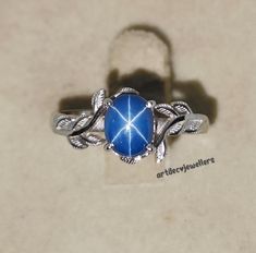 Vintage Blue Lindy Star Sapphire Leaf Ring, 6 Rays Star Gemstone, Star Saffire Ring, 925 Sterling Silver, Christmas day Gift for Her *Material - 925 Sterling Silver/ 14k rose gold/ 14k white gold/ 14k yellow gold *gemstone - lab created blue lindy star sapphire *Stone shape-  oval cut cabochon *gemstone Colour -  Blue *Gemstone Size - 6×8 mm  *stone weight -  2.10ct  *Band Colour - 925 sterling silver/ u can customized on the band colour *Ring For Women & Girls *astrological engagement ring *Ple Star-shaped Sterling Silver Sapphire Ring, Star-shaped Silver Sapphire Ring, Celestial Style Silver Sapphire Ring For Anniversary, Celestial Star-shaped Sapphire Gemstone Ring, Celestial Star-shaped Sapphire Ring, Celestial Star Sapphire Jewelry, Star-shaped Sapphire Ring As Gift, Star-shaped Sapphire Ring For Gift, Star-shaped Sapphire Rings For Anniversary