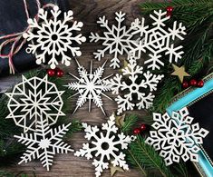 snowflakes and other christmas decorations on a table