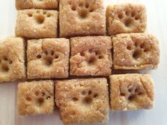 several square pieces of food sitting on top of a table