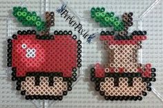 two pieces of beaded art made to look like an apple and a deer with green leaves