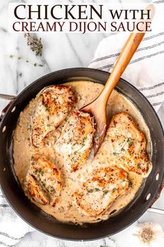 chicken with creamy dijon sauce in a skillet