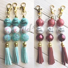 four different key chains with tassels on them