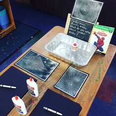 the table is set up with art supplies for kids to use on their own projects