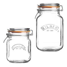 two glass jars with lids and labels on them