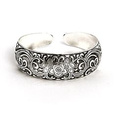 This is a perfect bracelet for nature-lovers and fashionistas alike! Our Vintage Style Flowering Vines Cuff Bracelet has an intricate design around the curved face, starting with a flower in the middle and blooming outwards. Swirls of petals and vines continue along the bracelet, eventually tapering off to just a lustrous silver end. A simple etched edge gives the slightest frame to the design. At 7.5 inches, this adjustable cuff is stunning on its own, or can be paired with other Bali styles fo Personalized Cuff Bracelets, Coordinates Jewelry, Metal Cuff Bracelet, Family Tree Necklace, Monogram Jewelry, Flowering Vines, Cz Stud Earrings, Engraved Jewelry, Metal Bracelets