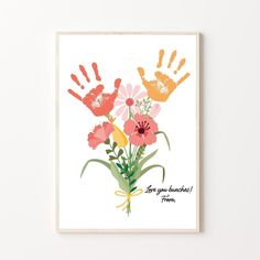 a card with flowers and hand prints on it