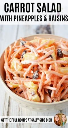 carrot salad with raisins in a bowl on a wooden table