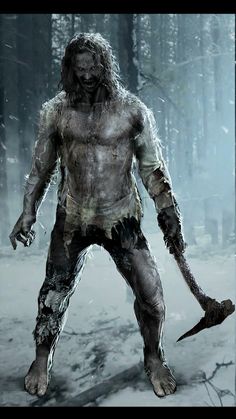 a man in the woods holding a large knife and wearing white paint on his body