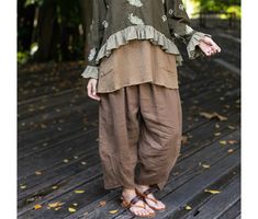 Casual brown linen pants for women with pockets and elastic waist, oversized linen pants, plus size linen trousers, brown harem linen pants STYLE - Low- crotch/ drop crotch - Harem - Elastic waistband - 2 side pockets COLORS/MATERIALS 1. Brown - 100% medium weight linen  - Unlined 2. Grey - 100% medium weight linen - Partially lined with 100% cotton 3. Light brown - Cotton rayon mix, embroidered - Partially lined with rayon fabric 4. Natural - 100% medium weight linen, embroidered - partially lined with 100% cotton 5. Off-white - 100% medium weight linen - Partially lined with 100% cotton 6. Army green - 100% medium weight linen - Unlined  SIZING The following measurements are of the pants itself. - Waist circumference: Stretching from 24 to 55 in. (61 - 140 cm.) - Hips circumference of th Oversized Linen Pants, Linen Pants Plus Size, Brown Linen Pants, Linen Pants Style, Linen Pants For Women, Plus Size Linen, Pants Plus Size, Linen Trousers, Linen Pants