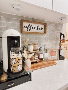 there is a coffee bar with various items on the counter