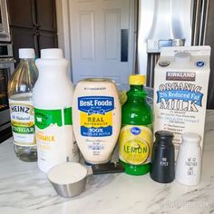 an assortment of milk, eggs, and other ingredients on a kitchen counter