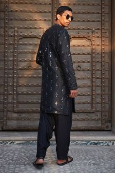 Black straight kurta featuring chikankari embroidery all over with mirror detailing. Paired with a solid salwar. - Aza Fashions Designer Ceremonial Kurta With Mirror Work, Traditional Black Bandhgala With Chikankari Embroidery, Black Bandhgala With Chikankari Embroidery For Transitional Season, Black Chanderi Sherwani With Chikankari Embroidery, Designer Black Sherwani With Chikankari Embroidery, Black Sherwani With Chikankari Embroidery For Festivals, Black Chikankari Embroidery Sherwani For Eid, Festive Black Sherwani With Chikankari Embroidery, Black Sherwani With Chikankari Embroidery