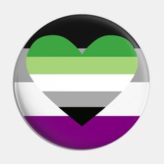 a heart shaped badge with the colors of the rainbow and black, white, green, purple