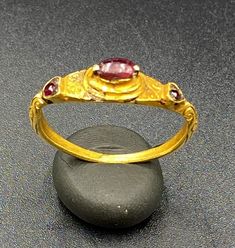 The Beautiful Antique Gold Ring Probably From South East Regions. Beautiful Garnet Gems Stone Is Place In The Ring. Size Details Pictures Are Listed Above. The Size Of This Ring Is USA 12. The Weight Is 4.34 Grams. 18 karat Gold .Test Certificate Available On Request Of Customer. Free And Fast Shipping World Wide. Traditional Ruby Ring In Yellow Gold, Traditional Oval Ring With 17 Jewels, Byzantine Oval Gemstone Ring, Oval Byzantine Gemstone Ring, Handmade Byzantine Oval Rings, Gold Ruby Rings With Intricate Design, Luxury Gold Ruby Ring With Intricate Design, Ceremonial Heirloom Oval Ruby Ring, Traditional Multi-stone Oval Rings