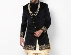 Handcrafted Designer Sherwani for groom made from the finest fabric will make you feel like a king on the happiest & most important day of your life. you can customize it according to your measurement as the fitting make it more beautiful to wear. COST INCLUDES SHERWANI,PANTS & STOLE(Dupatta) Black Sherwani For Groom On Eid, Black Long Traditional Wear For Wedding, Black Sherwani For Groom For Festivals, Black Sherwani For Groom At Festivals, Black Sherwani For Wedding And Eid, Black Sherwani For Winter Wedding, Black Sherwani For Wedding And Diwali, Black Wedding Sherwani For Eid, Black Wedding Sherwani For Winter