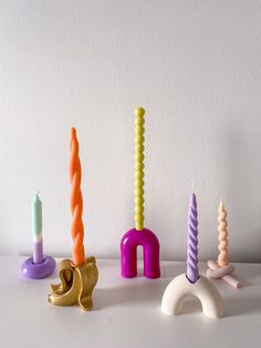 several candles are lined up on a table