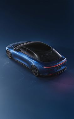 a blue sports car is shown from the top down, with its hood up and tail lights on