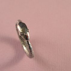 Because of the rounded shape of the serpant, this ring is actually a comfort fit. This piece can be worn as a ring or on a chain as a pendant... This ouroboros is about 3 times chunkier then my $44.00 ouroboros. This ouroborous ring is available at this price up to size 10. If you would like a larger size please contact me for pricing. Made to order, please allow about 1-2 weeks for delivery. Let me know what size you need (up to 10) Thanks for visiting my shop!! Silver Hand Forged Snake Ring Gift, Hand Forged Silver Snake Ring Gift, Unique Hand Forged Snake Ring, Unique Hand Forged Snake Ring As Gift, Snake-shaped Metal Rings As A Gift, Handmade Silver Snake Ring, Handmade Sterling Silver Snake-shaped Ring, Handmade Silver Round Snake Ring, Snake-shaped Engraved Rings For Gifts