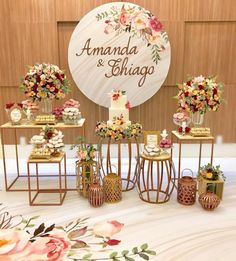 an arrangement of flowers on display in front of a sign that says amana and shingo