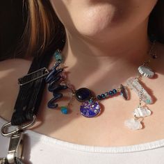 "This is a one of a kind necklace with handmade polymer clay number charms, upcycled blue glass bead, pink & blue crystal, marbled acrylic cloud charms, a marbled blue guitar pick, a blue acrylic daisy like flower & a handmade resin charm cast with purple/blue iridescent glitters & rainbow/silver stars. It measures to a minimum of 16\"W and can adjust up to 19\"W in circumference." Resin Charms, Adjustable Necklace, Silver Stars, Blue Crystals, Handmade Polymer Clay, Blue Glass, Pink Blue, Handmade Necklaces, Charm Necklace