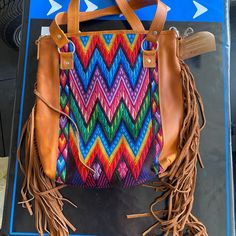 This Handmade Shoulder/Crossbody Bag Can Be Worn 2 Different Ways, And Comes With All Removable Straps. The Side Fringe Is 100% Genuine Leather. This Bag Is Made Out Of 100% Genuine Leather From Guatemala. There Is Only One Of These Bags, No Two Bags Are Made The Same. Multicolor Saddle Bag For Everyday Use, Multicolor Saddle Shoulder Bag For Travel, Multicolor Shoulder Saddle Bag For Daily Use, Multicolor Crossbody Saddle Bag For Everyday Use, Multicolor Crossbody Saddle Bag For Travel, Multicolor Crossbody Saddle Bag With Adjustable Strap, Multicolor Soft Leather Crossbody Bag, Multicolor Leather Saddle Bag For Daily Use, Multicolor Crossbody Hobo Bag