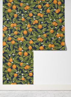 an orange print wallpaper with green leaves and white flowers on a dark blue background