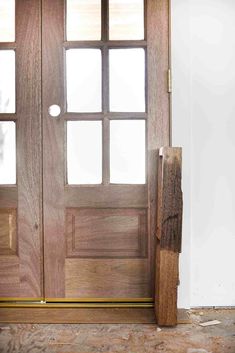 an image of a wooden door with glass on the front and side doors to both sides