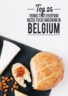 bread, cheese and nuts on a black board with the words top 35 things that everyone needs to eat and drink in belgium