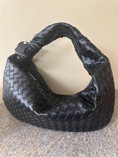 The ultimate everyday outfit accessory that will add a touch of style and sophistication to any look! This Large Genuine Leather Hobo handbag is perfect for all occasions, whether you're attending any party, an evening event, or just going out for everyday activities. The braid weave design exudes a stylish and trendy vibe that's perfect for any fashion-forward woman. The dumpling-shaped bag is made of cowhide leather, which gives it a luxurious look and feel. With functionality in mind, It come Modern Shoulder Bag As Fashion Accessory, Luxury Black Baguette Bag With Large Capacity, Luxury Large Capacity Pouch Hobo Bag, Handheld Shoulder Bag With Magnetic Closure For Daily Use, Luxury Large Capacity Hobo Bag, Black Rectangular Hobo Bag With Magnetic Closure, Handheld Bucket Bag With Removable Pouch, Black Baguette Bag With Magnetic Closure For Everyday, Black Hobo Bag With Magnetic Closure For Everyday Use