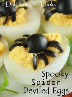 deviled eggs with black spider decorations on them and text that reads delicious as it looks spooky spider deviled eggs