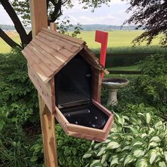 a wooden birdhouse with a hot tub in it