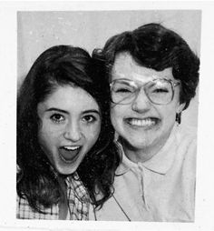 two old black and white photos of women smiling for the camera, one with glasses on her head