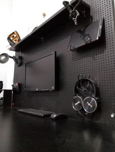 there is a computer monitor and speakers on the wall