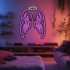 an angel wing neon sign in a living room