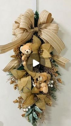 a teddy bear wreath hanging on the wall