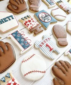 baseball themed cookies are arranged on a table