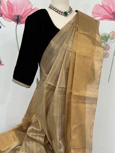 This party wear tissue saree is ideal for occasions when you want to look your best. It is made from high-quality materials and designed with precision to ensure a gorgeous look. The tissue saree is perfect for adding a hint of style and sophistication to any outfit. Black velvet blouse size 34-38 fall & pico done Elegant Cotton Silk Pre-draped Saree With Dupatta, Elegant Cotton Silk Pre-draped Saree For Festivals, Diwali Party Pre-draped Tissue Silk Saree, Elegant Pre-draped Cutdana Saree, Party Pre-draped Saree With Zari Work In Slub Silk, Elegant Cotton Silk Blouse Piece For Festive Season, Formal Art Silk Pre-draped Saree With Self Design, Elegant Festive Cotton Silk Blouse Piece, Gold Cotton Silk Pre-draped Saree