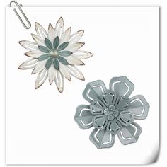 two metal flower clips on a white background