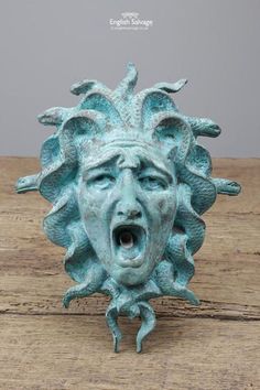 a blue ceramic face with its mouth open