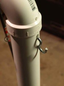 a close up view of a white pole on the ground