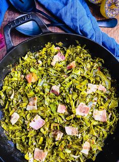 a pan filled with food on top of a wooden table