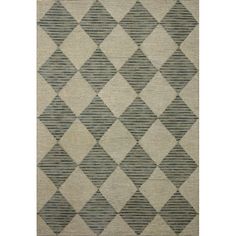 a gray and white rug with diamonds on it