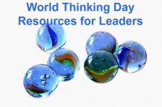 the words world thinking day resources for leaders are shown in blue and green marbles