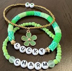 Super cute, stacking, perfect for St Patrick's Day bracelet 🙂. Charms may differ but all are green flower  Sold as a set of 3. The bracelets are 7 inches. St. Patrick’s Day, Lucky Charm Bracelet, St. Patricks Day, Clay Bracelet, Seed Bead Bracelet, Glass Bracelet, Saint Patrick, Green Flower, Seed Bead Bracelets