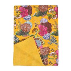 a yellow cloth with colorful flowers on it and a yellow pocket square in the middle