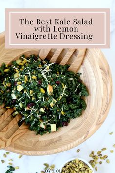 the best kale salad with lemon vinaigrete dressing in a wooden bowl