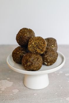 a white plate topped with chocolate balls on top of a table