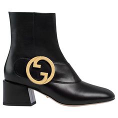 The design for this boot was inspired from 1970's archive pieces. The boots feature the vintage monogram round interlocking g detail in gold tone hardware. The boots are constructed of black leather with zip closure. The vintage Gucci logo detail provide a retro look! 700016 Color: Black Material: Leather Size: 39 EU / 8 US Heel Height: 50 mm / 2” Condition: Excellent. Like new. Tried on, but not worn. Made in Italy Gucci Luxury Ankle Boots, Gucci Luxury Boots For Fall, Gucci Designer Ankle Boots, Designer Gucci Boots For Fall, Designer Gucci Ankle Boots, Gucci Calf Leather Boots For Fall, Gucci Designer Leather Heeled Boots, Designer Leather Boots With Horsebit Detail, Gucci Designer Boots With Leather Sole